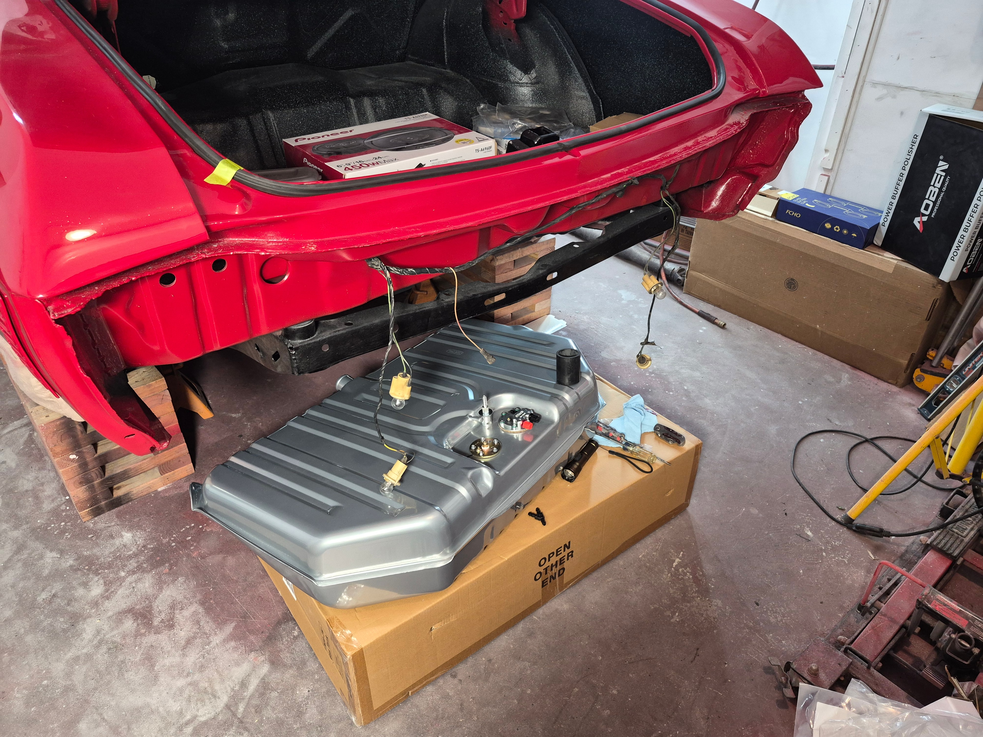Chevelle trunk open with Pioneer speakers and new fuel tank staged below